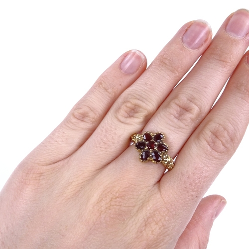 873 - A late 20th century 9ct gold garnet cluster flowerhead dress ring, setting height 14mm, size N, 4.2g