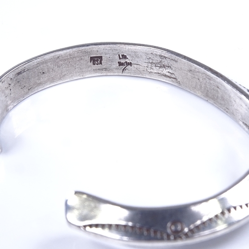 876 - A Native American Navajo sterling silver torque bangle cuff, maker's marks L Ml, band width 8.2mm, i... 