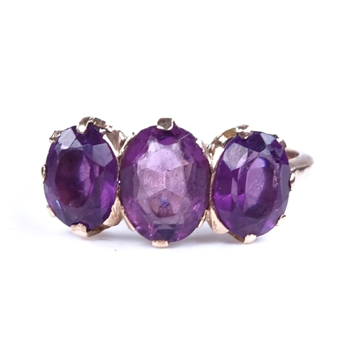 878 - An early 20th century 9ct gold 3-stone amethyst dress ring, setting height 8.6mm, size O, 2.4g