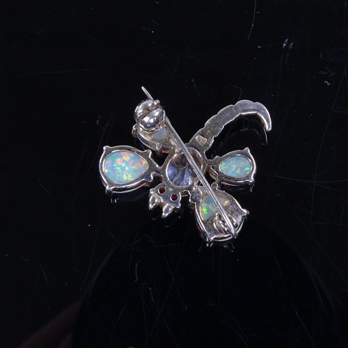 882 - A silver Gilson opal and white sapphire floral ring, and a similar silver opal and stone set dragonf... 