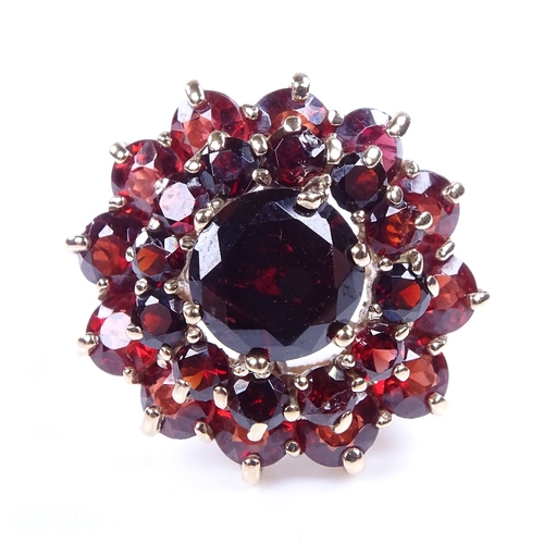 887 - A late 20th century 9ct gold garnet cluster flowerhead cocktail ring, setting height 21.7mm, size R,... 