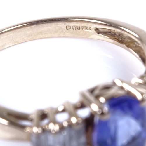 888 - A 9ct gold tanzanite and baguette-cut diamond dress ring, tanzanite length 7.6mm, size O, 2.7g