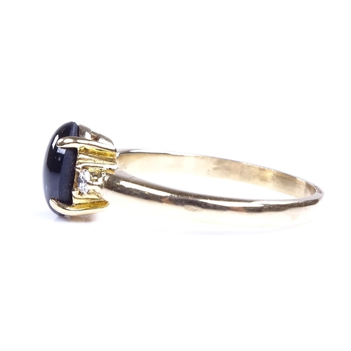 891 - A modern 18ct gold cabochon 6 rayed star sapphire and diamond dress ring, sapphire length 7.7mm, siz... 