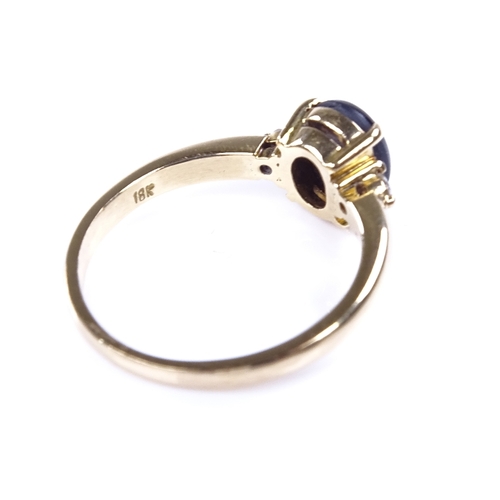 891 - A modern 18ct gold cabochon 6 rayed star sapphire and diamond dress ring, sapphire length 7.7mm, siz... 