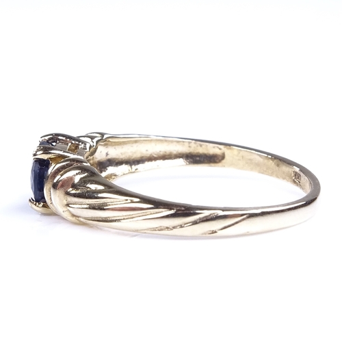 896 - A modern 9ct gold oval-cut sapphire dress ring, setting height 5.3mm, size M, 1.9g