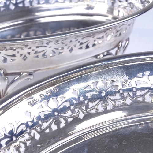 918 - A pair of George V oval silver bon bon dishes, pierced friezes with scrolled floral feet, by Joseph ... 