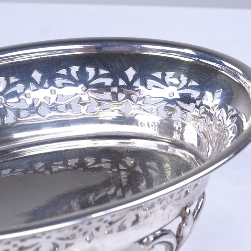 918 - A pair of George V oval silver bon bon dishes, pierced friezes with scrolled floral feet, by Joseph ... 