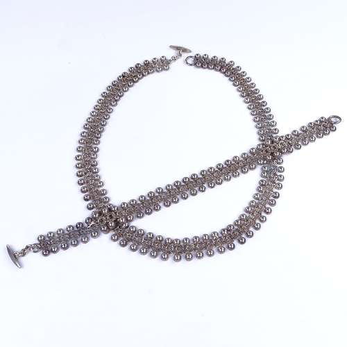 920 - HERMAN SIERSBOL - a Vintage Danish stylised sterling silver matching necklace and bracelet set,  nec... 