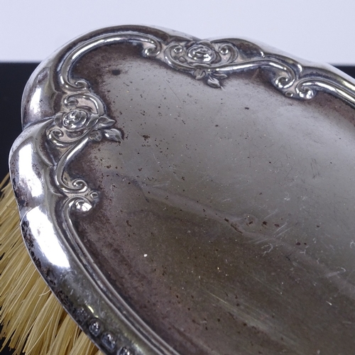 922 - 3 silver-backed dressing table items, comprising hand mirror and 2 hair brushes (3)