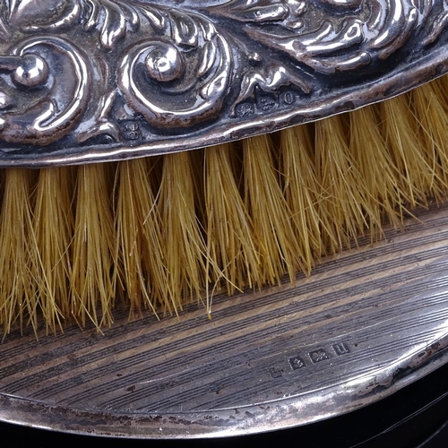 922 - 3 silver-backed dressing table items, comprising hand mirror and 2 hair brushes (3)