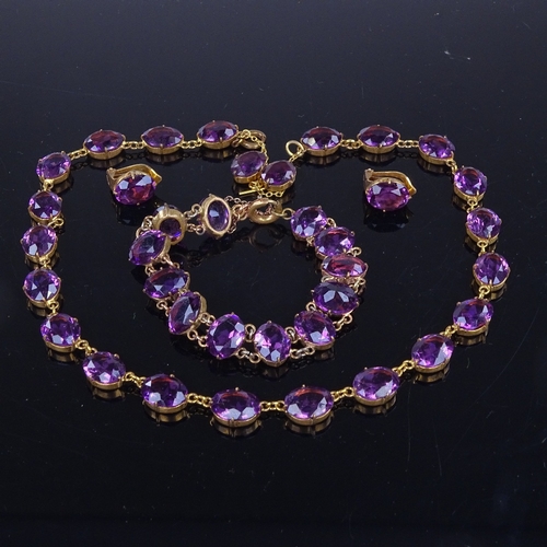 937 - A Vintage gilt-metal and amethyst Riviere demi parure, comprising necklace, bracelet and pair of cli... 