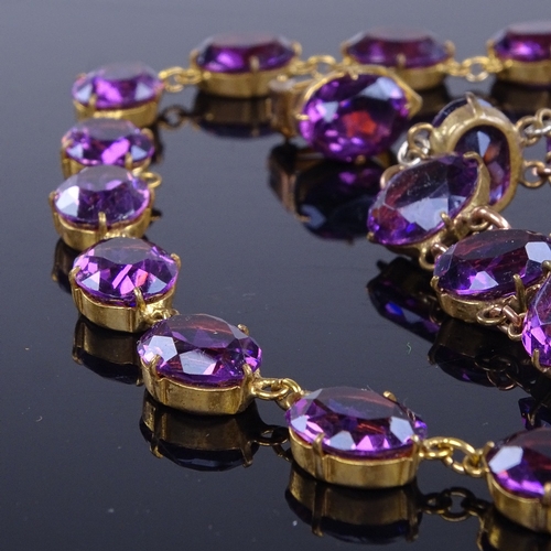 937 - A Vintage gilt-metal and amethyst Riviere demi parure, comprising necklace, bracelet and pair of cli... 