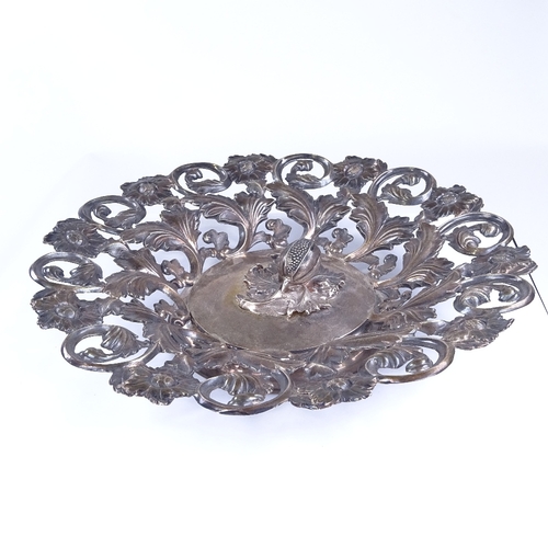 812 - A 19th century Austrian silver fruit bowl, Vienna 1858, relief embossed floral and fruit decoration,... 