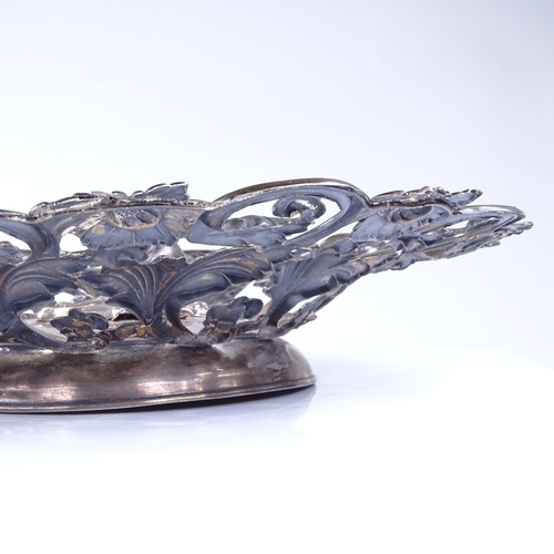 812 - A 19th century Austrian silver fruit bowl, Vienna 1858, relief embossed floral and fruit decoration,... 