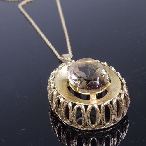 823 - A late 20th century 9ct gold smoky quartz pendant necklace on 9ct trace link chain, pendant height e... 