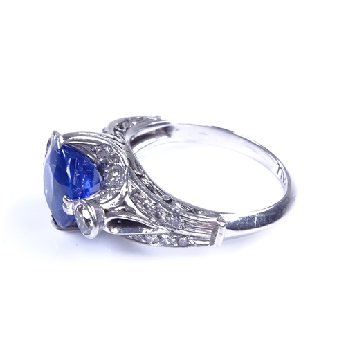 825 - A late 20th century palladium sapphire and diamond cluster dress ring, sapphire measures: length - 8... 