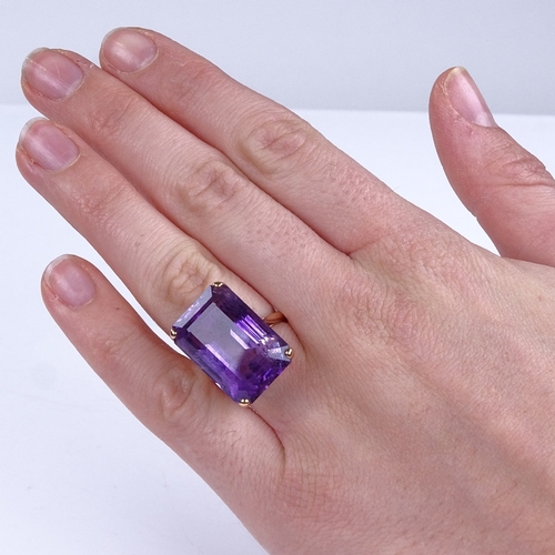 834 - A large late 20th century 14ct rose gold amethyst dress ring, amethyst length 21mm, size J, 10.8g