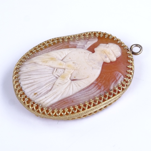 836 - A relief carved cameo shell panel pendant, depicting winged angel, in unmarked silver-gilt frame, pe... 