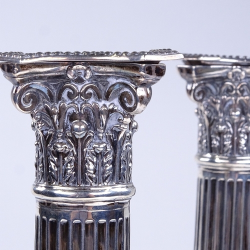 840 - A pair of Victorian silver Corinthian column table candlesticks, by James Charles Jay, hallmarks Lon... 