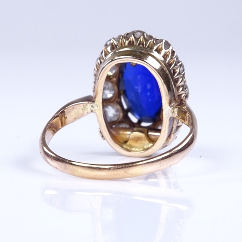 848 - A late 20th century unmarked high carat gold synthetic sapphire and diamond cluster ring, total diam... 