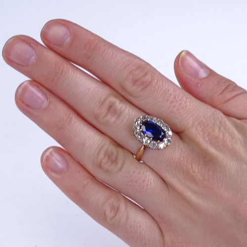 848 - A late 20th century unmarked high carat gold synthetic sapphire and diamond cluster ring, total diam... 