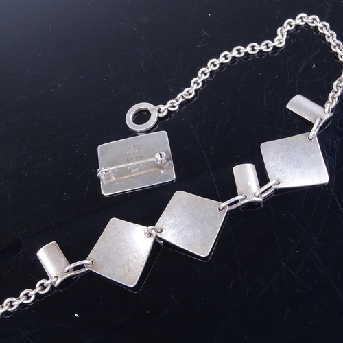 946 - TAGE HANSENS GULDSMEDIE - a Danish sterling silver necklace, length 38cm, and HASSAN KHIARE - a simi... 