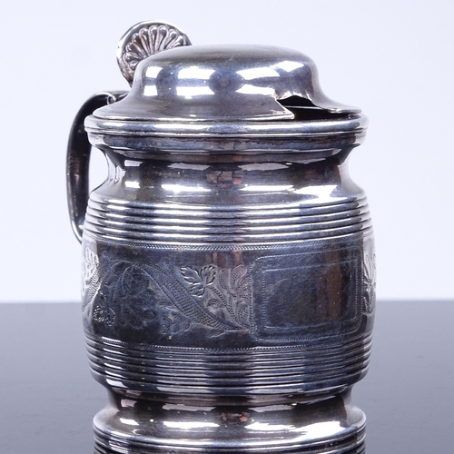 953 - A George III silver mustard pot, in the form of a half pint mug, reeded and bright-cut engraved foli... 