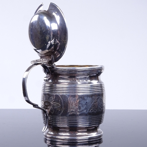 953 - A George III silver mustard pot, in the form of a half pint mug, reeded and bright-cut engraved foli... 