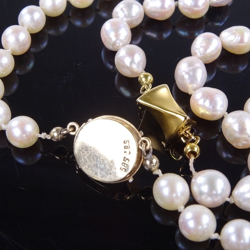 959 - 2 single-strand pearl necklaces, with 14ct gold clasps, both lengths 20