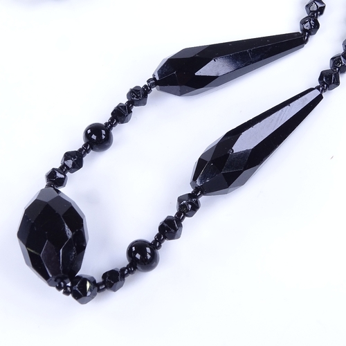 970 - A Vintage faceted jet necklace with unmarked silver clasp, necklace length 60cm, 35.9g