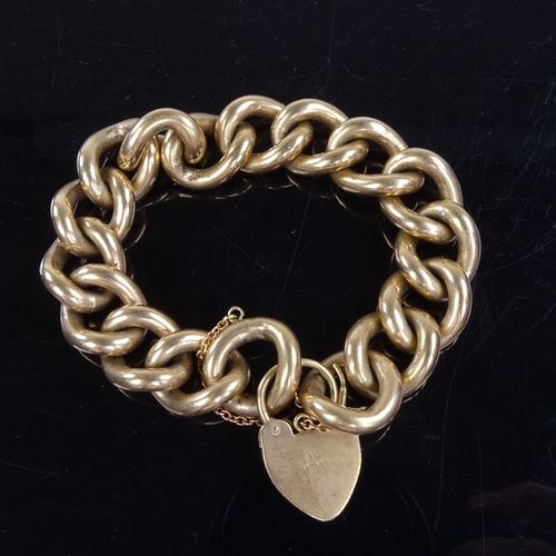 981 - A late 20th century solid 9ct gold curb link heart-padlock charm bracelet, bracelet length 16cm, 108... 