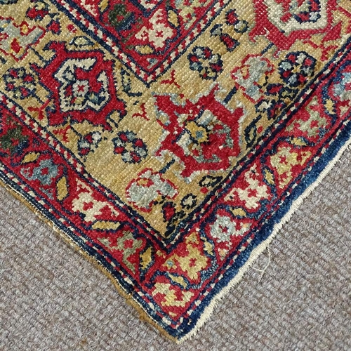 304 - A Persian handwoven geometric design rug