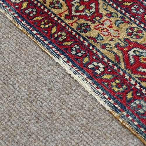 304 - A Persian handwoven geometric design rug