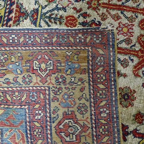 304 - A Persian handwoven geometric design rug