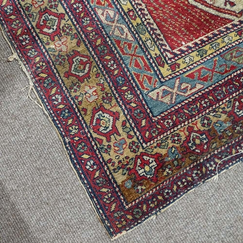 304 - A Persian handwoven geometric design rug