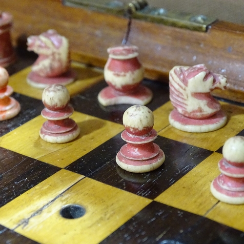 64 - A Jaques of London mahogany travelling chess set, mahogany-cased with rosewood and boxwood board, an... 