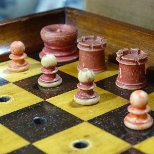 64 - A Jaques of London mahogany travelling chess set, mahogany-cased with rosewood and boxwood board, an... 