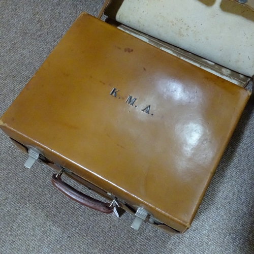 66 - A gentleman's leather travelling case, the interior fitted with original silver-topped cut-glass toi... 