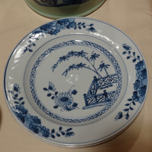 129 - A pair of Chinese blue and white porcelain plates, hand painted bamboo designs, diameter 23cm