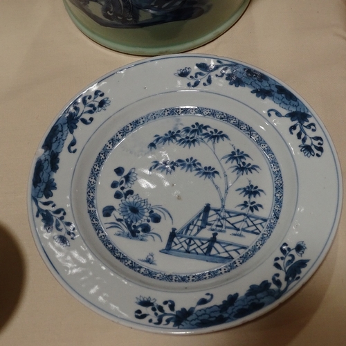 129 - A pair of Chinese blue and white porcelain plates, hand painted bamboo designs, diameter 23cm