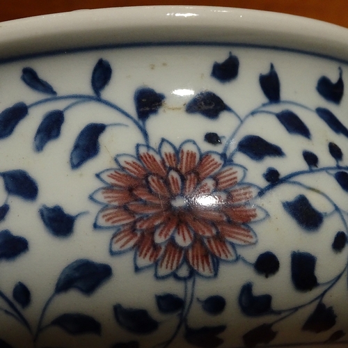 249 - A Chinese blue and white porcelain bowl, with red flowers, diameter 18cm, height 9.5cm