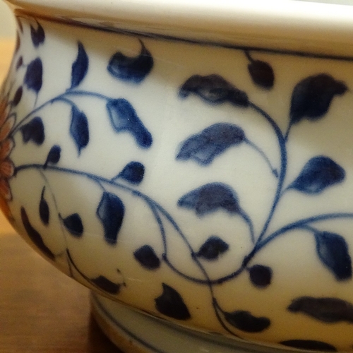 249 - A Chinese blue and white porcelain bowl, with red flowers, diameter 18cm, height 9.5cm