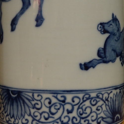 321 - A pair of Chinese blue and white porcelain cylinder vases, with painted horses, height 28cm, diamete... 