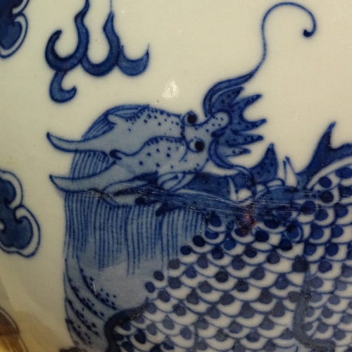 322 - A Chinese blue and white porcelain dragon design narrow-neck vase, 4 character mark, height 26cm