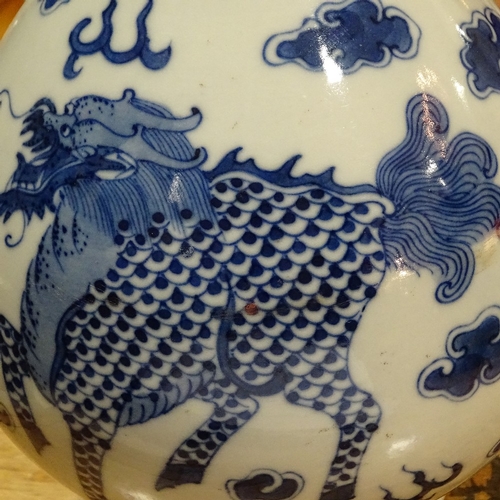 322 - A Chinese blue and white porcelain dragon design narrow-neck vase, 4 character mark, height 26cm