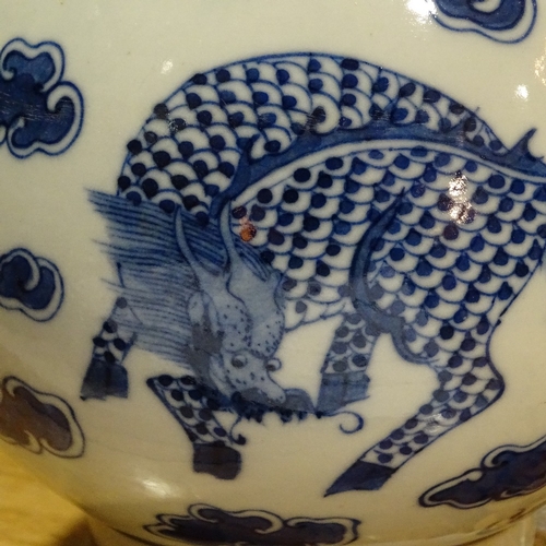 322 - A Chinese blue and white porcelain dragon design narrow-neck vase, 4 character mark, height 26cm