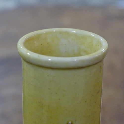 323 - A Chinese yellow glaze narrow-neck vase, with relief  prunus design, height 18cm