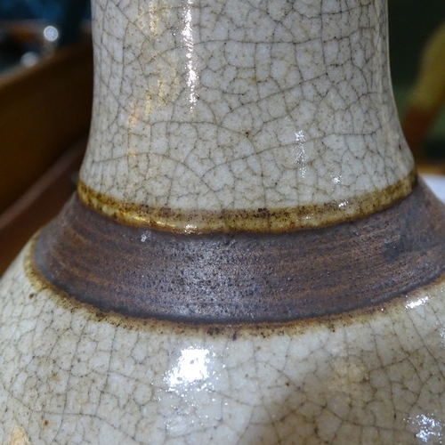 324 - A Chinese brown crackle glaze vase with relief prunus design, height 25cm