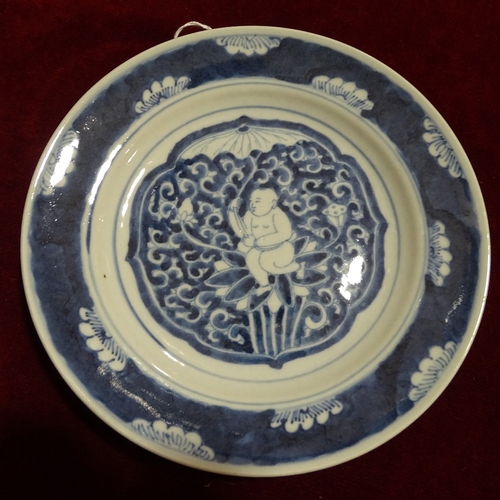 329 - A Chinese blue and white porcelain plate, with painted Buddha design, diameter 21cm