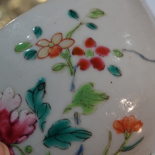 84 - A Chinese 18th century porcelain bowl with painted enamel flowers, diameter 11cm